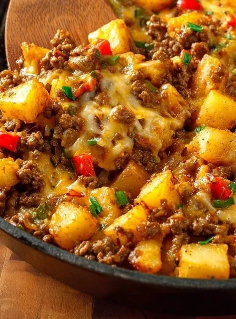 Ground Beef Potato Hash served on a plate with herbs and spices