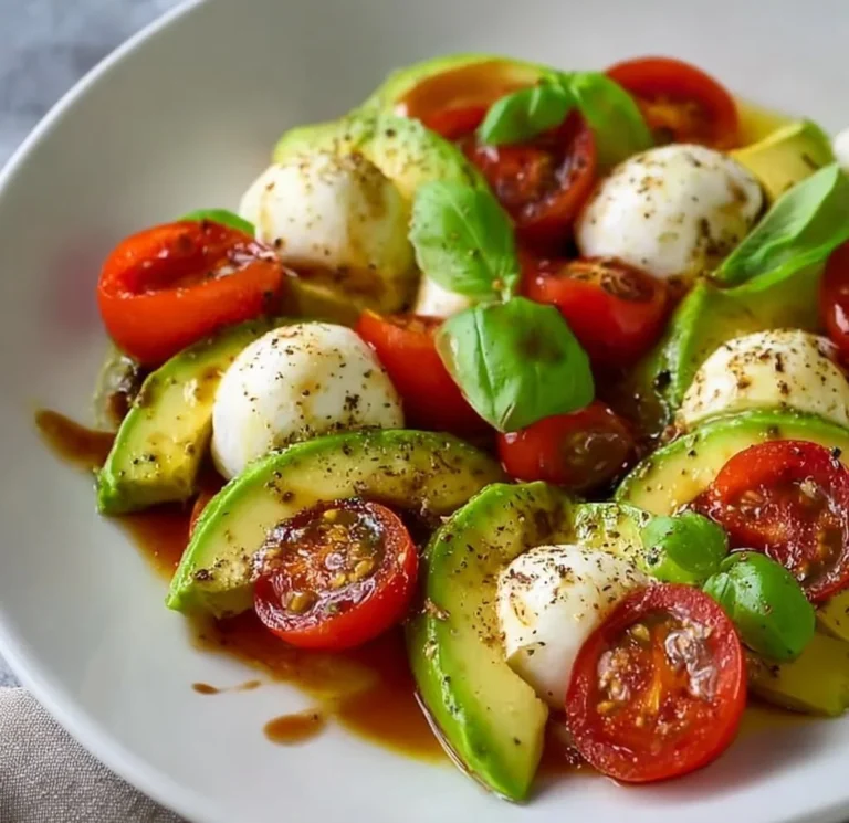 Light Avocado Caprese Salad with tomatoes, mozzarella, and basil